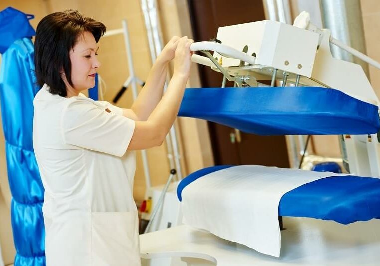 woman-doing-ironing-services-min